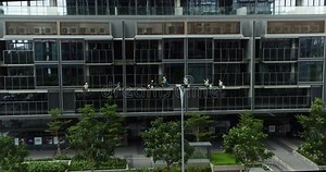 Window Washers Using Industrial Climbing Techniques Clean the Facade of a High-rise Building. High-rise Window Cleaners Stock Video - Video of hygiene, danger: 347163305