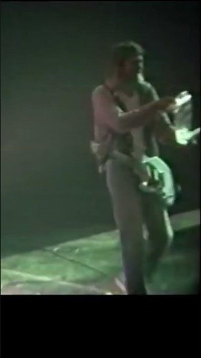 Kurt Cobain receives a fan-made portrait during a concert in Italy. February1994