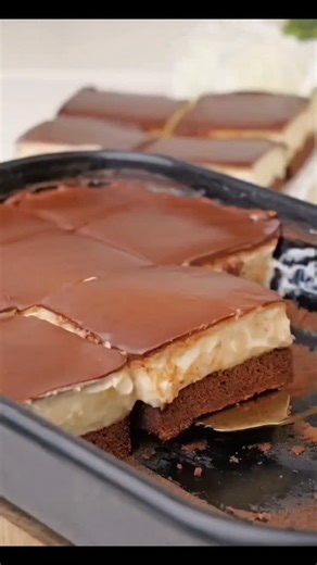 If I had to choose only one dessert to make forever, it would be this one. Ledena Kocka, also known as Ice Cube Cake, is pure nostalgia for me... This cake has everything you want in a dessert: a soft chocolate base soaked in vanilla syrup, a silky custard cream, and a glossy chocolate glaze that cracks gently under your fork. It’s elegant, simple, and irresistibly good, a little piece of heaven in every bite. Full recipe in story and on MacedonianCuisine.com Video credits to Dr.Oetker | Macedon