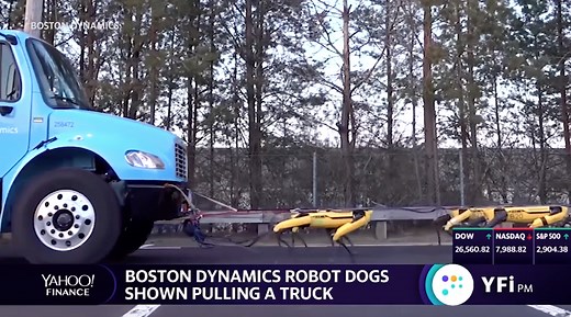 Rise of the robots: robot dogs shown pulling a truck in formation