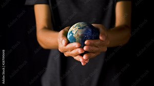 Female hand holding a realistic Earth. Holding the world in your hand. Rotation planet. Earth globe. World map design. Global sphere planet. Texture map courtesy of NASA.