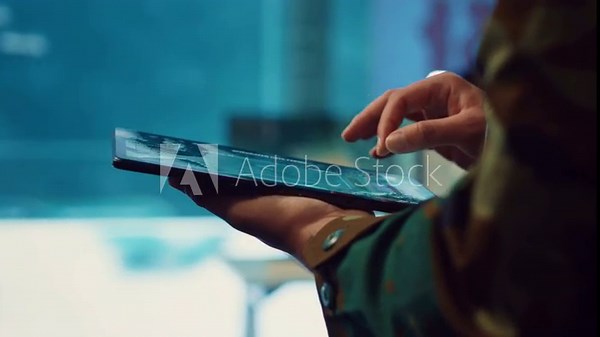 Army officer examines reconnaissance system on a world map, targeting enemy aircraft or warships on the national territory. Military personnel tracks status of deployed units. Close up. Camera A.