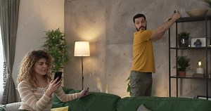 Couple at home connect and install cctv security surveillance camera