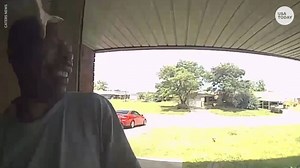 A snake struck and bit a man's face as he attempted to enter a home