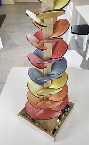 This handmade action toy provides hours of entertainment as the marbles bounce from petal to petal. https://bit.ly/3QA8oFT | Harvest Array