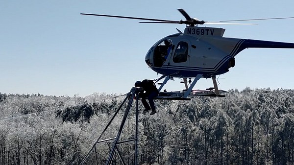 See daring linemen sit on helicopters to restore icy Mississippi power