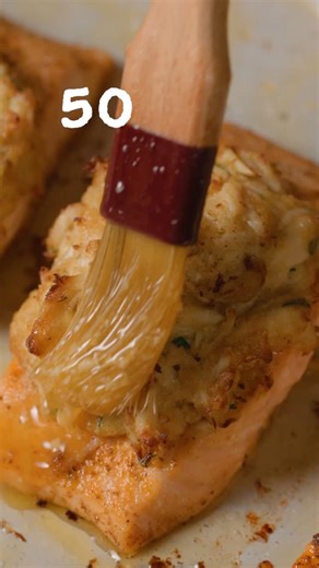 BuzzFeed Food on Instagram: "50 Garlic Clove Crab Cake Salmon is the weeknight flavor bomb you didn't know you needed ? Find the recipe below and linked in bio @joelleolol"