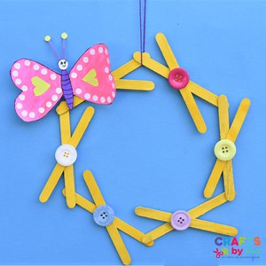 Paper heart butterfly craft on popsicle stick wreath - Crafts By Ria