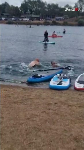 Paddleboard Fail: Hilarious Collision Sends Two Men Splashing! || WooGlobe
