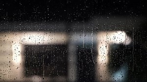 clip-1051190422-rainy-night-through-window