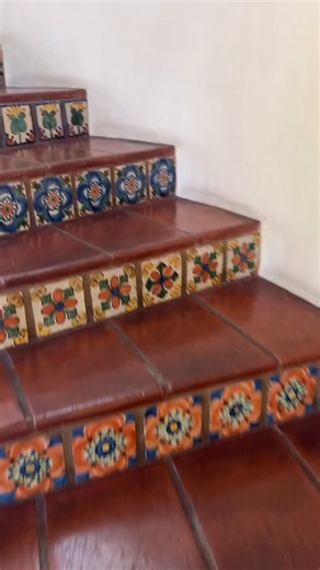 Imagine taking this staircase everyday. This handcrafted Talavera tile risers are a masterclass in Spanish Colonial Revival detail.