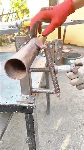 Adjusting the metal pipe position using a custom-built clamping mechanism for precise alignment