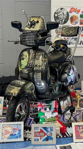 This lovely custom Vespa is owned by Richard Watson who rode it from Doncaster to Burton for the show, and it was so cold he literally had icicles on him when he arrived! It’s a T5 classic frame with a standard 200 engine. The paint is by Nimbus Airbrush Art and the scooter is a tribute to Michael Caine, Richard’s favourite actor, with The Italian Job being his favourite movie of all time. He wanted to stick to an original scooterboy style so added 80s-style accessories like the king & queen sea