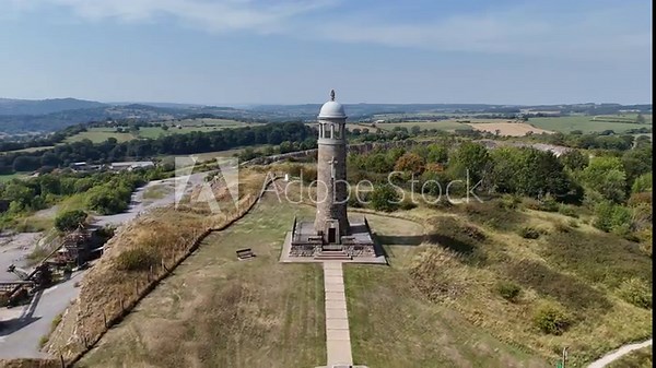 Crich, Derbyshire, England - August 13 2025: Aerial drone footage of Crich Stand war memorial and surrounding countryside. Scenic views from hilltop location.