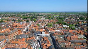 Aerial video captures medieval Louth, Lincolnshire. St James' Church and picturesque market town in view.