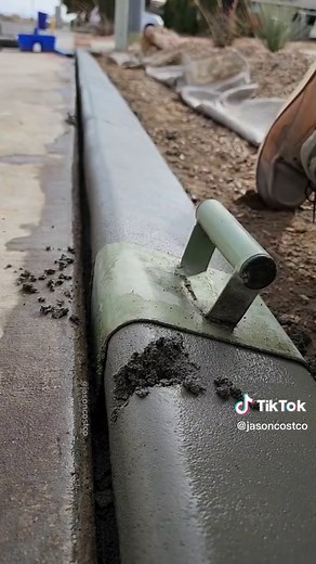 Found a surprise in the curb. #oddlysatisfying #asmr #concretecurb #construction #landscape #fix #repair