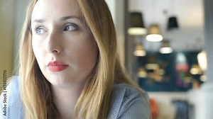 Pretty girl with red lips doing sad look to the camera, steadycam shot