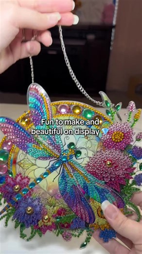 I have so many finished diamond paintings that just end up stored away… but this one actually becomes a suncatcher you can hang in your window. It catches the sunlight like stained glass once you finish placing all the gems. It even comes with the chain so you can hang it right away. I love adding things like this to my house that I can actually display. #DiamondArt #DiamondPainting #DiamondArtAddict #DiamondPaintingAddict #CraftTOK