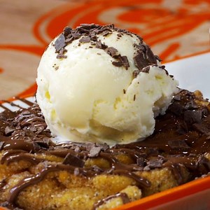 3.9K reactions · 503 shares | Our NEW Churro Funnel Cake is the love child of a doughnut and pancake! Made fresh to order, it's covered in cinnamon sugar, drizzled in melted milk chocolate and topped with vanilla ice cream and chocolate flakes! Who's keen to try it? | San Churro | Facebook