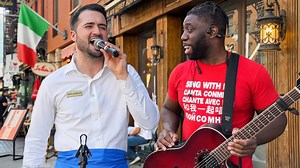 Watch this waiter wow the crowd with a song!