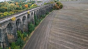 Drone footage of the wonderful Penistone Railway Station and Viaduct near Barnsley, South Yorkshire. Showing a ploughed field, bridge, woodland and railway tracks.