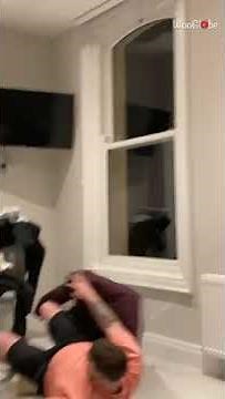 Man falls off chair trying to eat his lunch