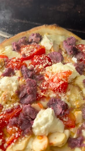 ‘Elepaio Pizza [eh-leh•pie•oh] on Instagram: "Loaded pizza is an offering. It’s abundance laid out in the open. No restraint. No minimalism. Just generosity. A sourdough crust becomes the foundation, fermented long enough to stay light, strong enough to carry everything that follows without losing itself. This is where guests step in. They arrive with ingredients wrapped in stories. Something grown. Something gathered. Something saved for the right moment. Hands meet the table. Ingredients meet