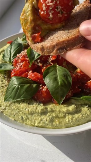 Creamy basil hummus topped with fried tomatoes