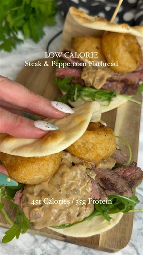 Steak & Peppercorn Folded Flatbread Nutrition ⬇️ Per flatbread Calories - 451 Fat - 17.7g Carbs - 37.7g Protein - 35.2g Ingredients ⬇️ Serves 2 255g Beef Rump Steak, Fat Trimmed Salt & Black Pepper. To Taste ½x Medium onion, Diced 1x Tsp Very Lazy Chopped Garlic 100ml Beef Stock 100ml Elmlea Single Alternative to Cream 1x Tbsp Mixed Peppercorns, Ground ¼x Tsp White Pepper, Ground 1x Tbsp Worcestershire Sauce 150ml 2x Asda Plain Folded Flatbreads 60g Battered Onion Rings, Cooked Rocket, Fresh Met