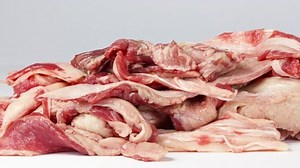 slider drive along a assembly line of meat remnants