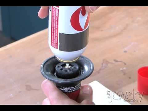 Art Jewelry - Filling a butane torch with fuel