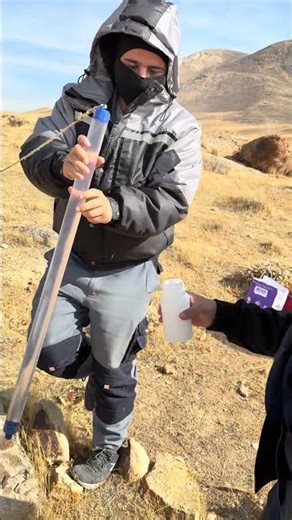 Using a bailer to collect groundwater samples from an observation well