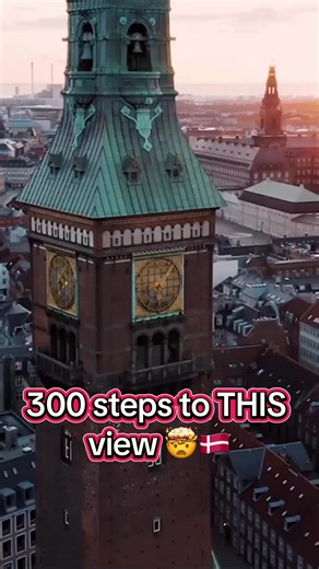 300 steps later... 😮‍💨 This is the iconic Copenhagen City Hall Tower (Københavns Rådhus), standing at 105.6 meters tall! It’s home to the legendary Jens Olsen’s World Clock and offers one of the best 360 views over Copenhagen and Tivoli. Would you climb to the top? 🇩🇰✨. #copenhagen #denmark #traveleurope #dronevideo #architecture