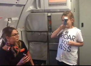 This is the moment a little girl gets a whole Easyjet plane of passengers clapping - with her important announcemnt. Nine-year-old Astrid, from Southport, stood up in front of a plane full of holiday-goers in a bid to spread the message and garner support for a little girl fighting cancer. | Aviation Figure