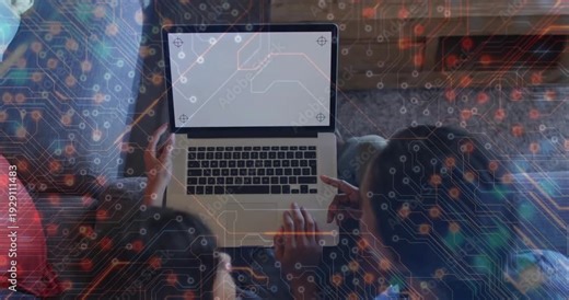 Mom and teen pointing at laptop showing alignment marks, starting circuit overlay for tech