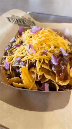 Comfort food just went ALL-PRO 🏈🔥 Our Frito Chili Mac is loaded, cheesy, and built to win. Crunchy Fritos, hearty chili, and melty mac coming together like a championship drive. Cozy up, dig in, and let your tastebuds celebrate a BBQ win! Order Online | https://billysimsbbq.com | Billy Sims BBQ