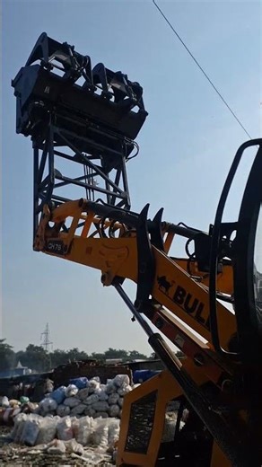 bull machine fitted paper mill bucket