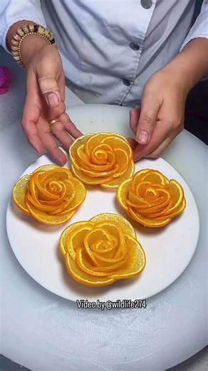 Thousands of Tips on Instagram: "Check out this awesome trick from wildlife274 for creating a gorgeous orange rose that’s perfect for any fruit platter. First, grab a fresh orange and a sharp knife. Since the orange into thin, even rounds. Then, arrange the slices in a circular pattern, slightly overlapping each slice to create a rose shape. And that’s it! You have a beautiful, fragrant orange rose that will elevate any fruit platter. It’s the perfect way to add a touch of elegance Credits:@wild