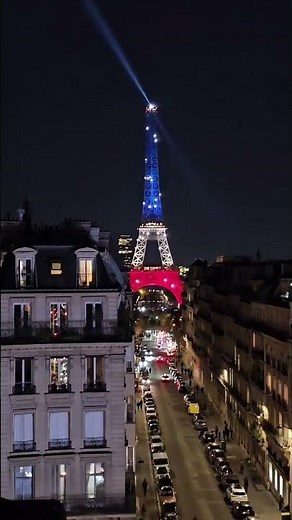 Eiffel Tower shines beautifully at night, glowing in golden lights that make Paris look truly magica