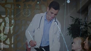 Interacting with child, doctor with medical data animation in school setting