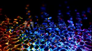 Awesome bg with magic particles float in liquid, light rays like laser show, light effects and bokeh, DOF. Glowing multi-colored particles circle underwater forming cloud. Luma matte as alpha channel.