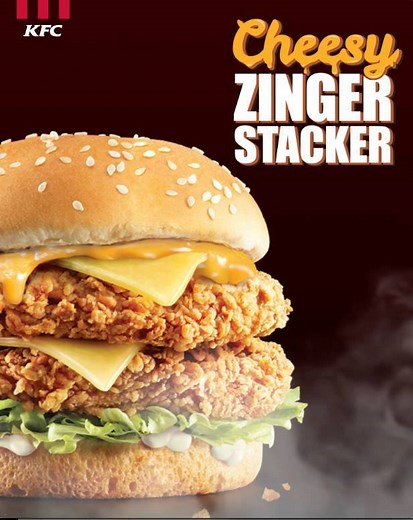 What’s better than 1 Zinger Burger? TWO. Introducing the all-new KFC Cheesy Zinger Stacker – with 2 Zinger fillets, 2 cheese slices, and 2 classic sauces with fresh lettuce, layered between two soft sesame buns. Don't do a double take — get double the indulgence with the KFC Cheesy Zinger Stacker today! #KFCZingerStacker #KFCsg See more @ po.st/KFCZingerStacker | KFC