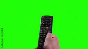 Hand holding Remote Control on Green Screen. You can replace green screen with the footage or picture you want. You can do it with “Keying” effect in After Effects.