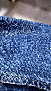 Classic, rugged denim texture with durable twill weave, diagonal ribbing, and a slightly rough surface in deep indigo.