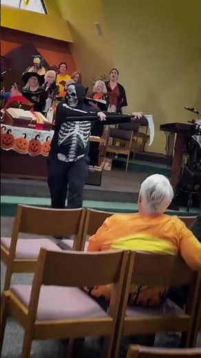 Progressive church singing 'Dem Bones' for their Halloween praise and worship church service