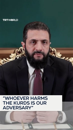 In his latest speech, Syrian President Ahmed al Sharaa rejected ethnic divisions, saying no group holds superiority except through righteousness. Addressing Kurdish communities directly, he denied accusations of hostility, pledged protection for Kurds, and announced a decree guaranteeing their rights under the law. He also urged displaced people to return safely and take part in rebuilding and preserving the unity of the country. | TRT World