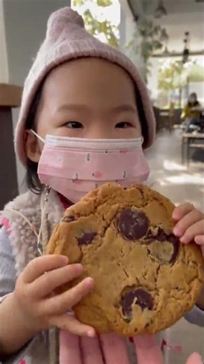 Cute baby tries to eat a cookie the size of her head #shorts