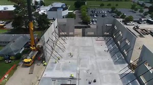 Crofton Crane Rental & Rigging assists CW Brinkley by placing tilt-up panels at a new school building in Chesapeake, VA with their 300-ton Grove all-terrain crane. Credit: Crofton Industries #PileBuck #EandCmedia #marineconstruction #crane #construction | Pile Buck Magazine