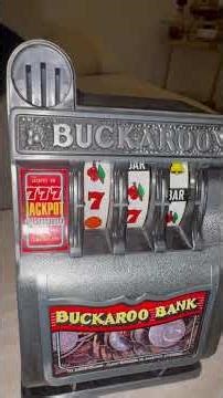 Vintage “Buckaroo Bank” Slot Machine Toy.