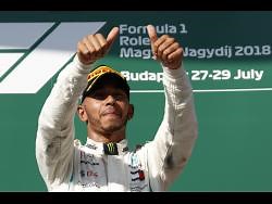 Hamilton wins in Hungary, keeps Vettel at bay